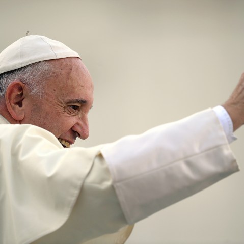 Pope Francis waves to the crowd aboard his Popemobile as he arrives for an audience with participants of an international pilgrimage of altar servers on Aug. 4, 2015 in Saint Peter's Square at the Vatican. (Photo by Filippo Monteforte/AFP/Getty)