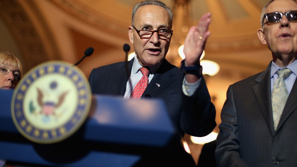 Sen. Charles Schumer and Senate Minority Leader Harry Reid talk with reporters after the weekly Democratic policy luncheon at the U.S. Capitol on Aug. 4, 2015 in Washington, DC. (Photo by Chip Somodevilla/Getty)