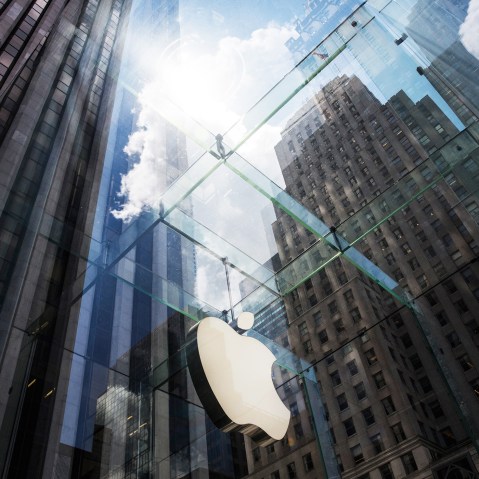 The Apple logo hangs on the Apple Store on Fifth Avenue on Aug. 5, 2015 in New York, N.Y. (Photo by Andrew Burton/Getty)