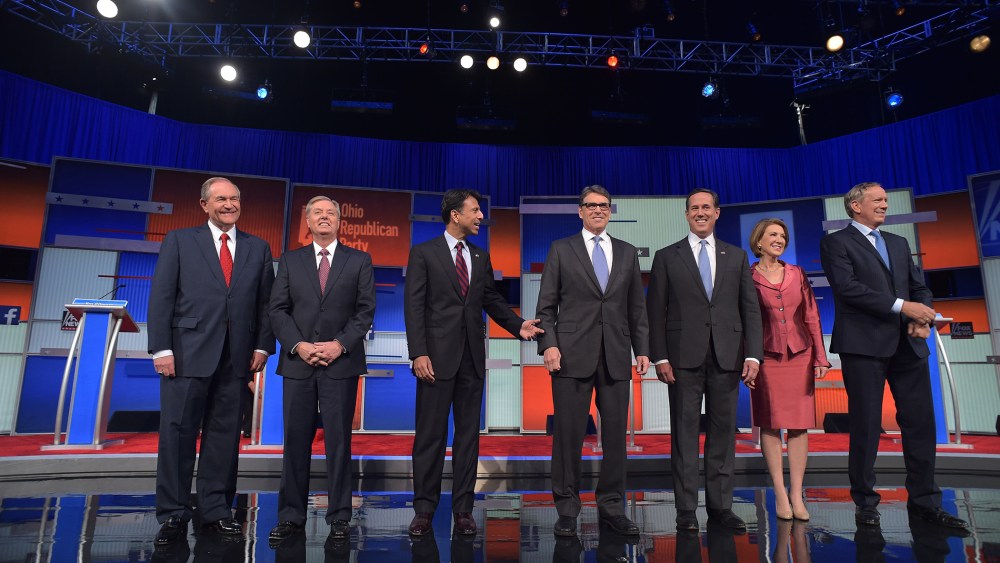 Republican presidential hopefuls arrive on stage for the start of the Republican presidential primary debate on Aug. 6, 2015 at the Quicken Loans Arena in Cleveland, Ohio. (Photo by Mandel Ngan/AFP/Getty)