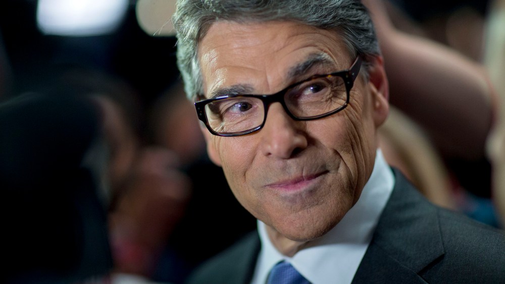 Rick Perry, 2016 Republican presidential candidate, pauses while speaking to the media in the spin area after a televised forum ahead of the first Republican presidential debate in Cleveland, Ohio, Aug. 6, 2015. (Photo by Andrew Harrer/Bloomberg/Getty)