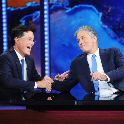 Stephen Colbert and Jon Stewart appear on "The Daily Show with Jon Stewart" #JonVoyage on August 6, 2015 in New York City. (Photo by Brad Barket/Comedy Central/Getty)