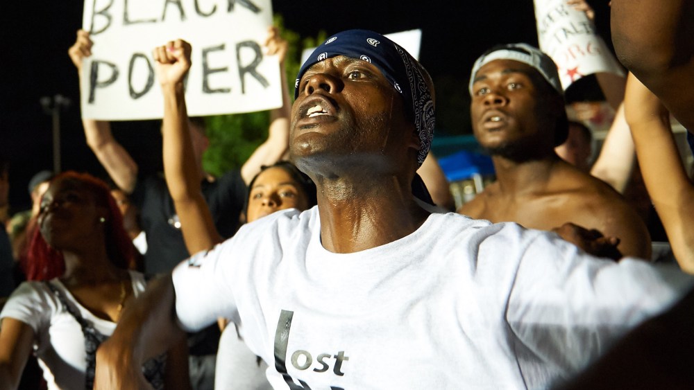 Demonstrators protest during a march on Aug. 8, 2015 at the Ferguson Police Department in Ferguson, Mo. (Photo by Michael B. Thomas/AFP/Getty)
