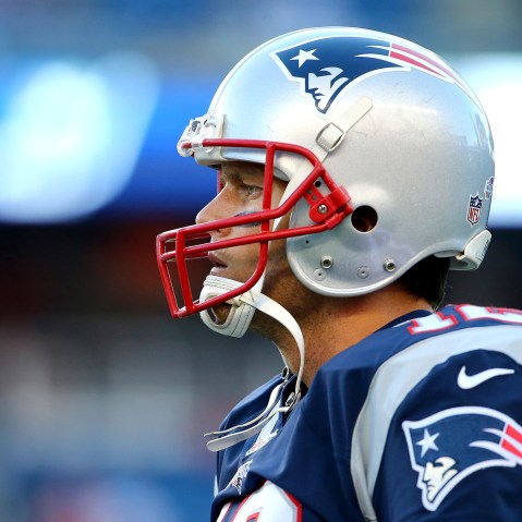 Tom Brady #12 of the New England Patriots warms up prior to a preseason game against the Green Bay Packers at Gillette Stadium on Aug. 13, 2015 in Foxboro, Mass. (Photo by Maddie Meyer/Getty)