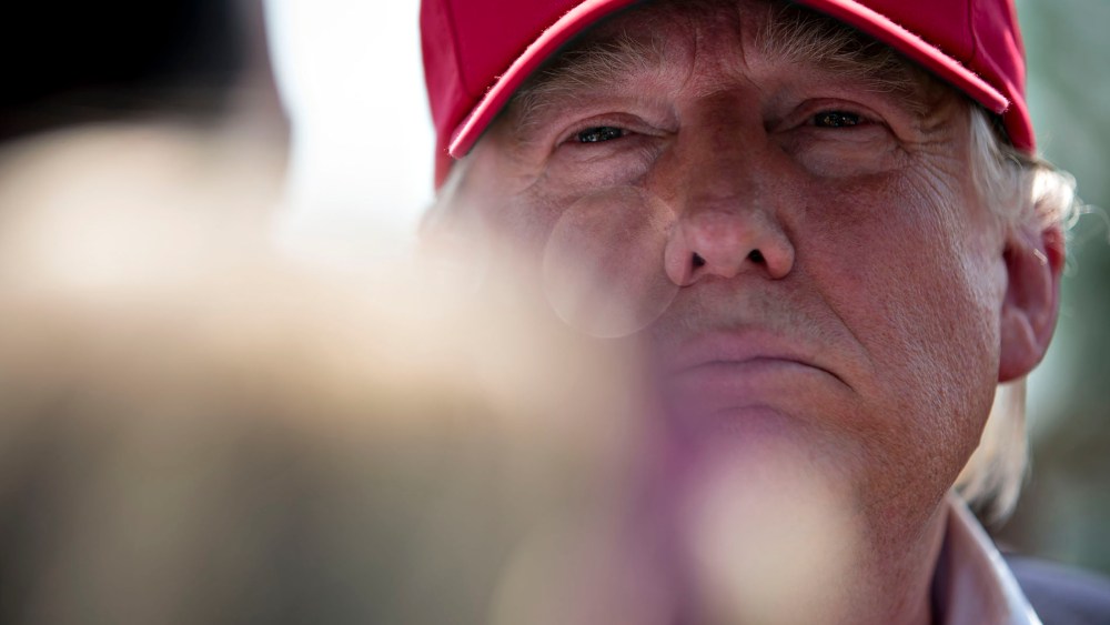 Donald Trump pauses while speaking to the media after arriving on his personal helicopter near the Iowa State Fairgrounds in Des Moines, Ia., Aug. 15, 2015. (Photo by Daniel Acker/Bloomberg/Getty)