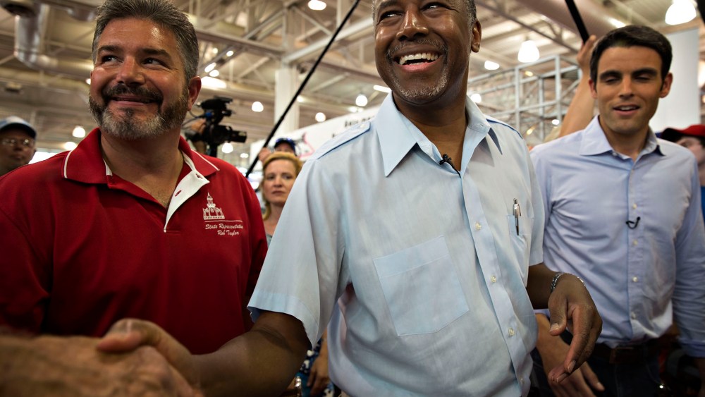 Ben Carson, 2016 Republican presidential candidate, greets attendees as he tours the Iowa State Fair in Des Moines, Ia., Aug. 16, 2015. (Photo by Daniel Acker/Bloomberg/Getty)
