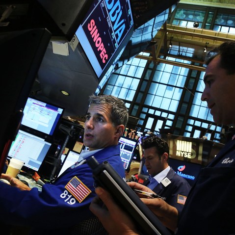 Traders work on the floor of the New York Stock Exchange (NYSE) on Aug. 21, 2015 in New York, N.Y. (Photo by Spencer Platt/Getty)