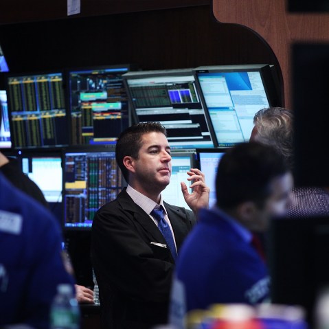 Traders work on the floor of the New York Stock Exchange (NYSE) on Aug. 25, 2015 in New York City. (Photo by Spencer Platt/Getty)