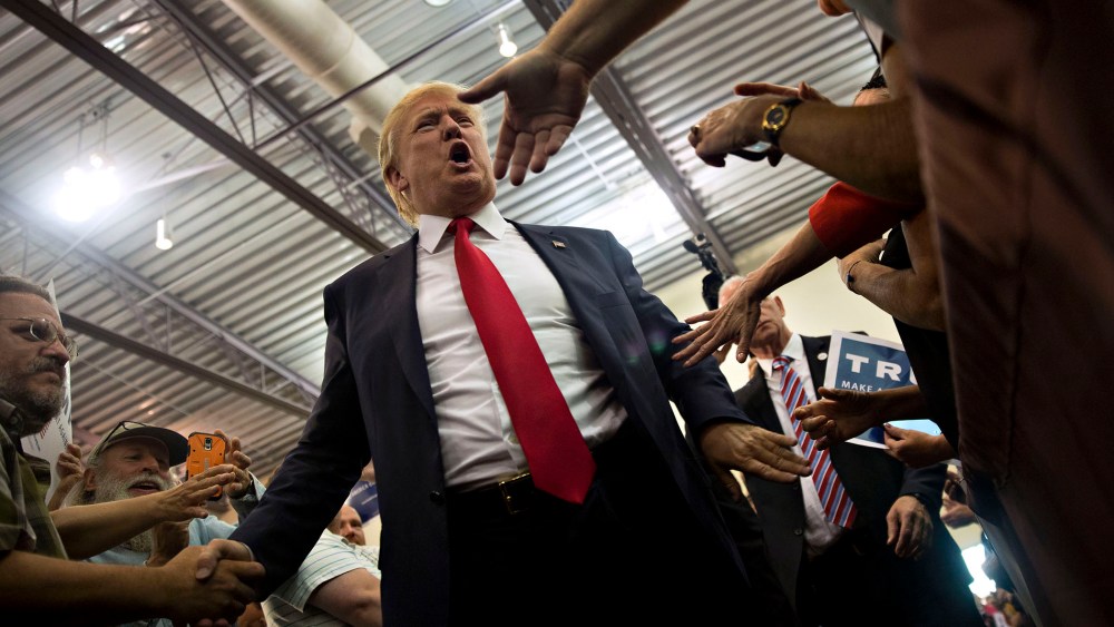 Republican presidential candidate Donald Trump greets attendees during a rally at Grand River Center in Dubuque, Iowa, Aug. 25, 2015. (Photo by Daniel Acker/Bloomberg/Getty)