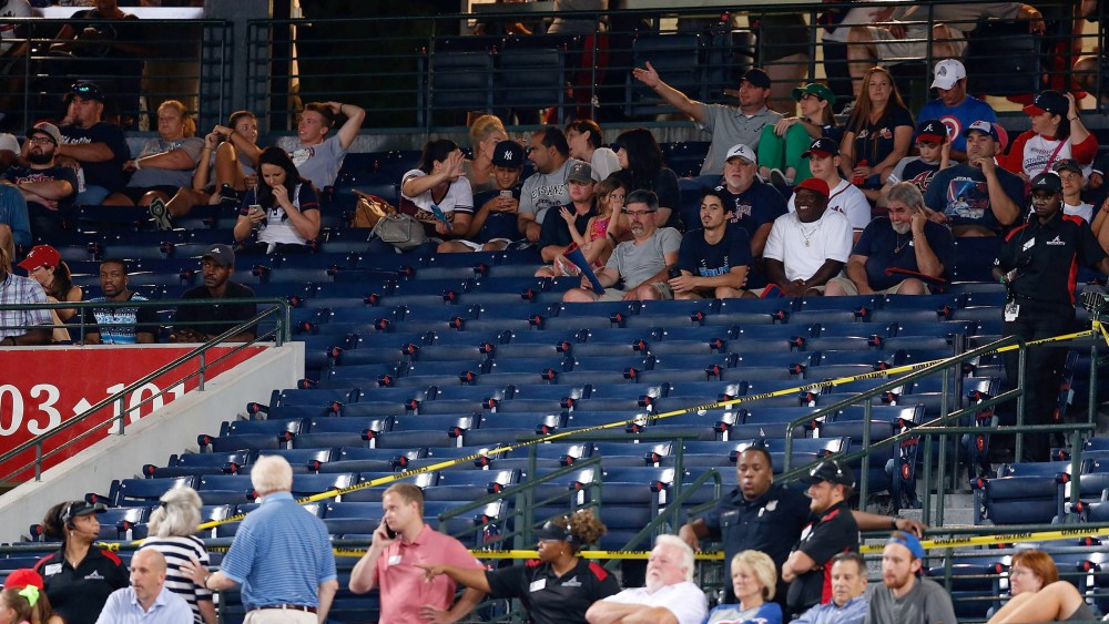 Police block off a section with police tape after a fan fell from the upper deck of Turner Field in the seventh inning during the game between the Atlanta Braves and the New York Yankees on Aug. 29, 2015 in Atlanta, Ga. (Photo by Mike Zarrilli/Getty)