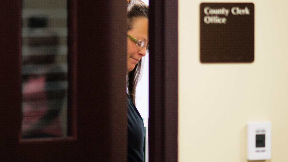 Kim Davis, the Rowan County Clerk of Courts, closes the door to her office after denying a marriage license at the County Clerks Office on September 2, 2015 in Morehead, Kentucky. (Photo by Ty Wright/Getty)