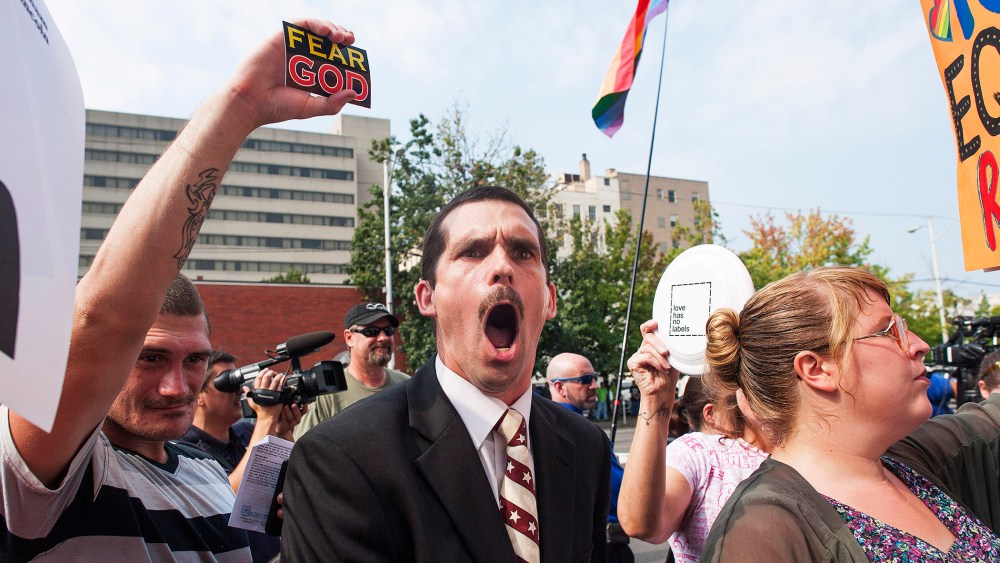A protestor yells out against same-sex marriage supporters in front of the federal courthouse September 3, 2015 in Ashland, Kentucky. (Photo by Ty Wright/Getty)