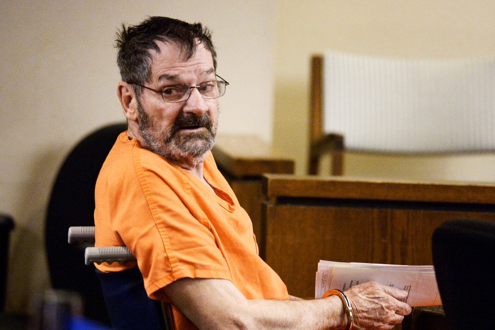 Frazier Glenn Cross, also known as Frazier Glenn Miller, sits with his defense team after being wheeled into a Johnson County courtroom for a scheduling session April 24, 2014, in Olathe, Kanas. (Photo by John Sleezer-Pool/Getty)