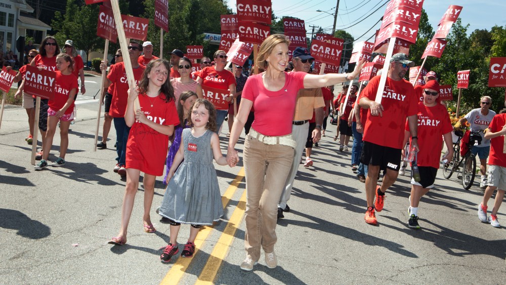 Republican presidential candidate Carly Fiorina marches with her family in the Labor Day parade on Sept. 7, 2015 in Milford, N.H. (Photo by Kayana Szymczak/Getty)