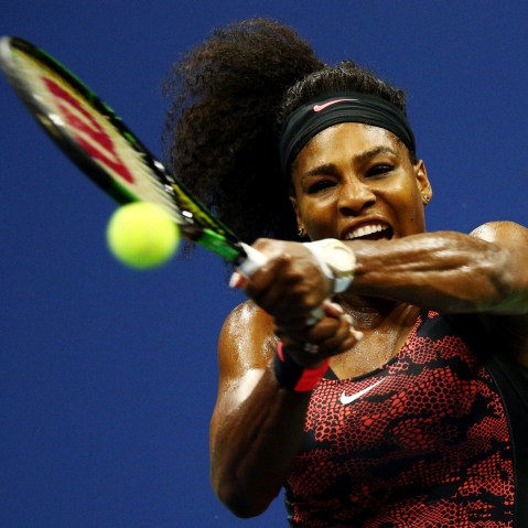 Serena Williams returns a shot to Venus Williams, both of the United States, during their Women's Singles Quarterfinals match on Day Nine of the 2015 US Open on Sept. 8, 2015, New York City. (Photo by Clive Brunskill/Getty)