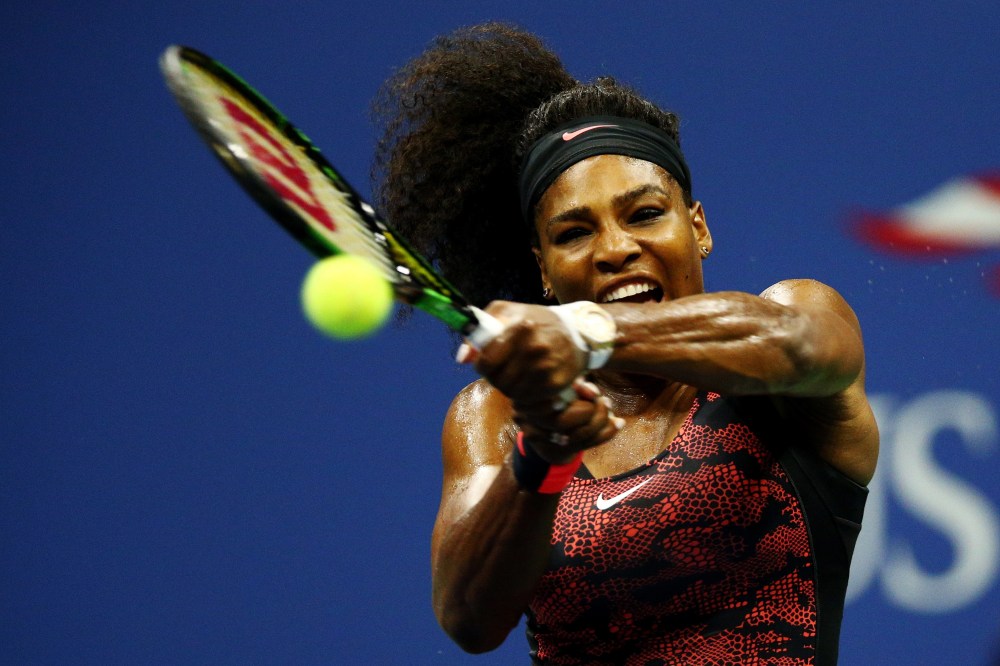 Serena Williams returns a shot to Venus Williams, both of the United States, during their Women's Singles Quarterfinals match on Day Nine of the 2015 US Open on Sept. 8, 2015, New York City. (Photo by Clive Brunskill/Getty)