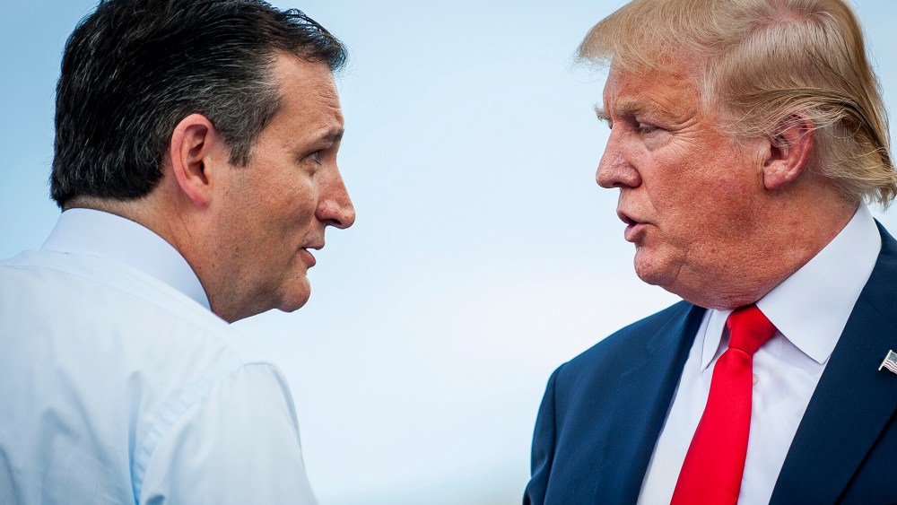 Republican presidential candidate Ted Cruz speaks with fellow candidate Donald Trump during a Tea Party Patriots rally against the Iran nuclear deal on Capitol Hill in Washington, D.C., Sep. 9, 2015. (Photo by Pete Marovich/Bloomberg/Getty)