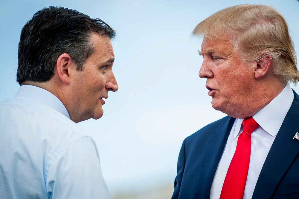 Sen. Ted Cruz (R-Texas) speaks with Donald Trump during a Tea Party Patriots rally against the Iran nuclear deal on Capitol Hill in Washington, D.C., on Sept. 9, 2015. (Photo by Pete Marovich/Bloomberg/Getty)