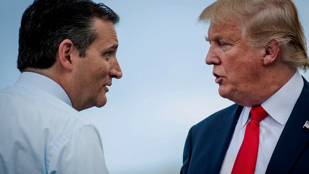 Sen. Ted Cruz (R-Texas) speaks with Donald Trump during a Tea Party Patriots rally against the Iran nuclear deal on Capitol Hill in Washington, D.C., on Sept. 9, 2015. (Photo by Pete Marovich/Bloomberg/Getty)