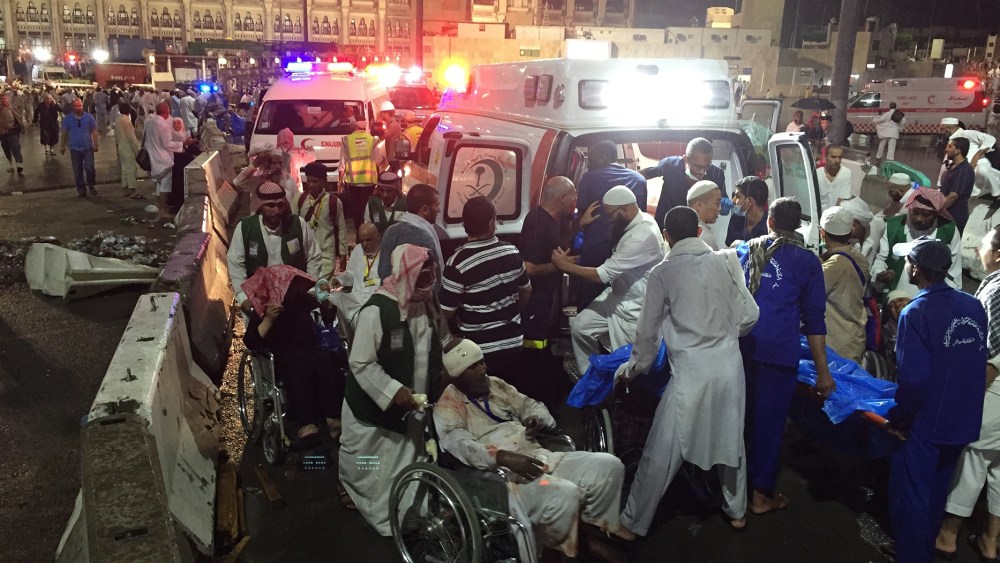 Paramedics and officials hospitalize wounded people after a construction crane collapsed over the Muslim pilgrims around the Muslims' holy place Kaaba in Mecca, Saudi Arabia on Sep. 11, 2015. (Photo by Ozkan Bilgin/Anadolu Agency/Getty)