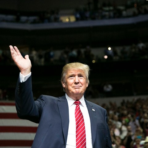Republican presidential candidate Donald Trump waves during a campaign rally at the American Airlines Center in Dallas, Texas on Sept. 14, 2015. (Photo by Laura Buckman/AFP/Getty)