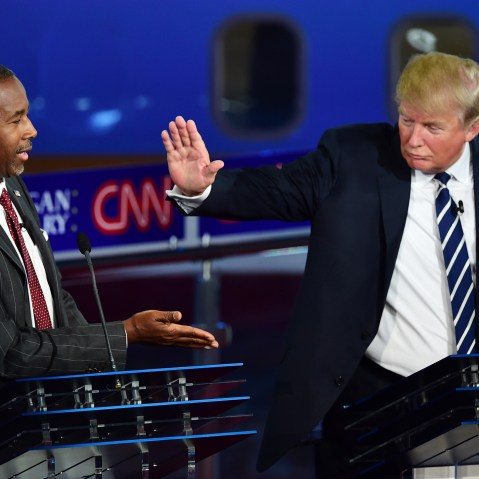 Republican presidential hopefuls Ben Carson and Donald Trump high five during the second Republican Presidential Debate held at the Ronald Reagan Presidential Library in Simi Valley, Calif. on Sept. 16, 2015. (Photo by Frederic J. Brown/AFP/Getty)