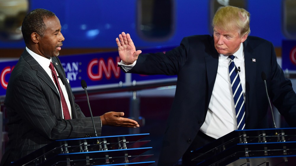 Republican presidential hopefuls Ben Carson and Donald Trump high five during the second Republican Presidential Debate held at the Ronald Reagan Presidential Library in Simi Valley, Calif. on Sept. 16, 2015. (Photo by Frederic J. Brown/AFP/Getty)