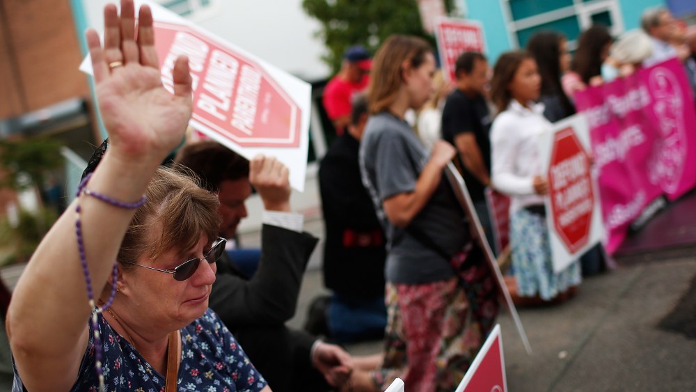Right to Life advocate Linda Heilman prays during a sit-in in front of a proposed Planned Parenthood on Sept. 21, 2015 in Washington, DC. (Photo by Win McNamee/Getty)