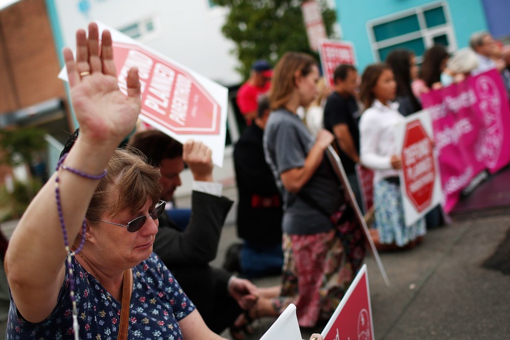 Right to Life advocate Linda Heilman prays during a sit-in in front of a proposed Planned Parenthood on Sept. 21, 2015 in Washington, DC. (Photo by Win McNamee/Getty)