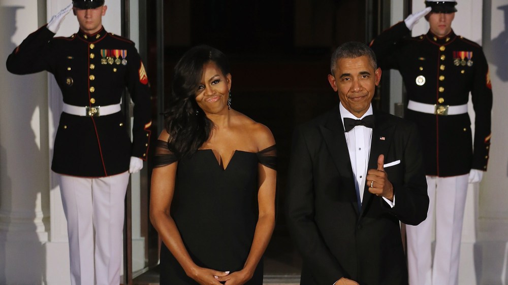 President Obama gives a thumbs-up about First Lady Michelle Obama's dress while waiting on the North Portico for the arrival of Chinese President Xi Jinping and his wife Madame Peng Liyuan, Sept. 25, 2015, Washington, DC. (Photo by Chip Somodevilla/Getty)