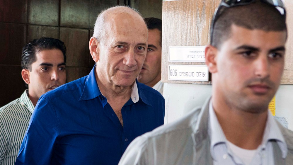 Former Israel prime minister Ehud Olmert (C) is sentenced to 6 years accusation of corruption in Tel Aviv, Israel on May 13, 2014. (Photo by Jack Guez/Anadolu Agency/Pool/Getty)