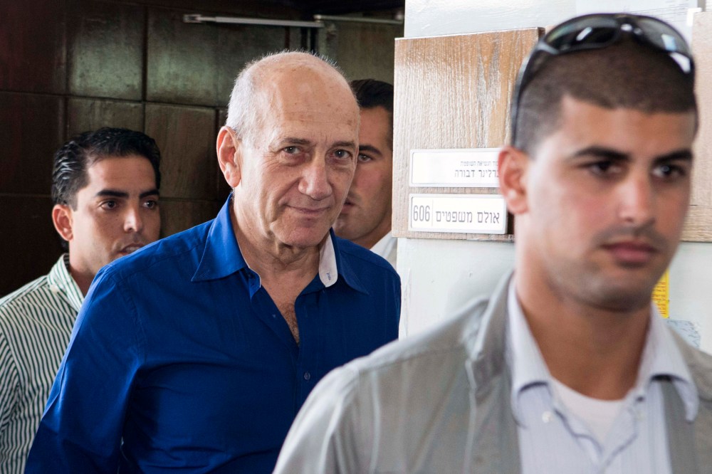 Former Israel prime minister Ehud Olmert (C) is sentenced to 6 years accusation of corruption in Tel Aviv, Israel on May 13, 2014. (Photo by Jack Guez/Anadolu Agency/Pool/Getty)