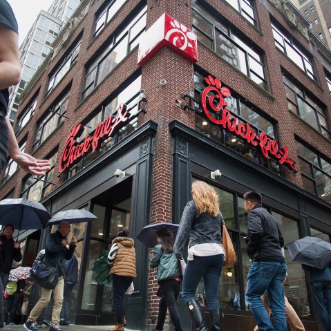 Pedestrians walk past a Chick-fil-A restaurant in New York, N.Y., on Oct. 2, 2015. (Photo by Michael Nagle/Bloomberg/Getty)