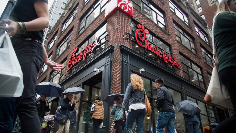 Pedestrians walk past a Chick-fil-A restaurant in New York, N.Y., on Oct. 2, 2015. (Photo by Michael Nagle/Bloomberg/Getty)
