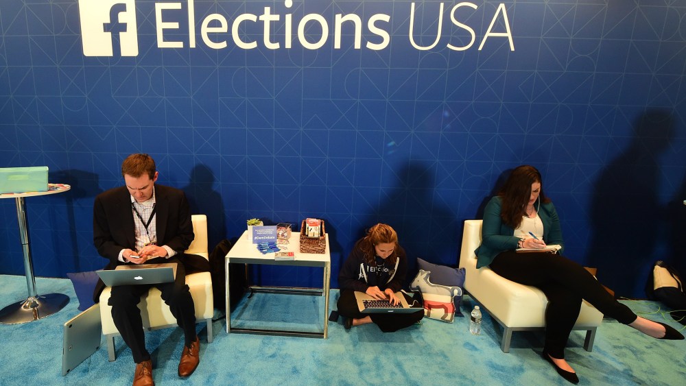 Journalists in the Facebook section take notes ahead of the Democratic presidential debate at the Wynn Hotel in Las Vegas, Nev., on Oct. 13, 2015, hours before the first Democratic Presidential Debate. (Photo by Frederick J. Brown/AFP/Getty)