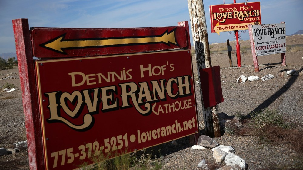 Signs for Dennis Hof's Love Ranch Las Vegas brothel are shown on Oct. 14, 2015 in Crystal, Nev. (Photo by Alex Wong/Getty)