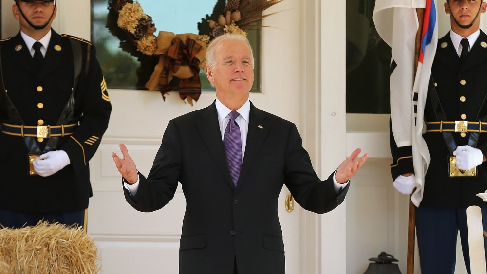 Vice President Joe Biden reacts to reporters' questions about him running for president while he waits for the arrival of President Park Geun-hye of South Korea at the Naval Observatory, Oct. 15, 2015 in Washington, DC. (Photo by Chip Somodevilla/Getty)