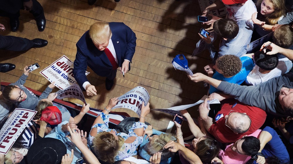 Republican presidential candidate Donald Trump greets guests after speaking at a campaign rally at Burlington Memorial Auditorium on Oct. 21, 2015 in Burlington, Iowa. (Photo by Scott Olson/Getty)