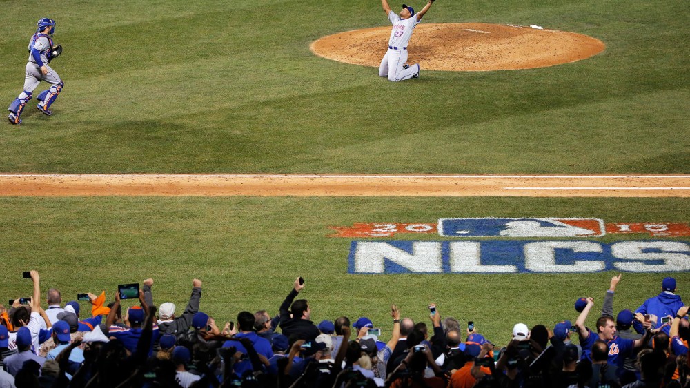 Jeurys Familia #27 and Travis d'Arnaud #7 of the New York Mets celebrate after defeating the Chicago Cubs in game four of the 2015 MLB National League Championship Series at Wrigley Field on Oct. 21, 2015 in Chicago, Ill. (Photo by Jon Durr/Getty)