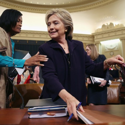 Hillary Clinton and Former State Department Chief of Staff Cheryl Mills take a break in a hearing of the House Select Committee on Benghazi Oct. 22, 2015 on Capitol Hill in Washington, DC. (Photo by Chip Somodevilla/Getty)