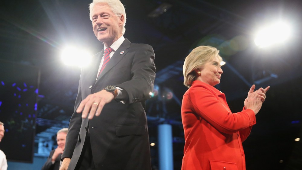 Democratic presidential candidate Hillary Clinton and her husband former president Bill Clinton greet guests at the end of the Jefferson-Jackson Dinner on Oct. 24, 2015 in Des Moines, Iowa. (Photo by Scott Olson/Getty)