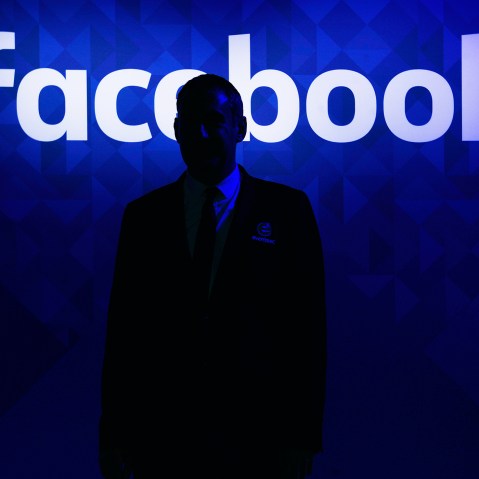 A security guard stands at the entrance to the Facebook Inc. lounge at the Web Summit in Dublin, Ireland, Nov. 3, 2015. (Photo by Aidan Crawley/Bloomberg/Getty)