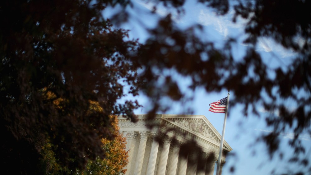 The United States Supreme Court building is framed by fall foliage on Nov. 6, 2015 in Washington, D.C. (Photo by Chip Somodevilla/Getty)