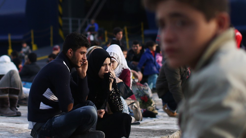 Migrants wait to board a ferry to Athens in Mytilene port on Nov. 10, 2015 in Lesbos, Greece. (Photo by Carl Court/Getty)