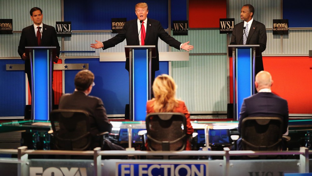 Presidential candidate Donald Trump speaks while Sen. Marco Rubio (R-FL) and Ben Carson look on during the Republican Presidential Debate at the Milwaukee Theatre Nov. 10, 2015 in Milwaukee, Wis. (Photo by Scott Olson/Getty)