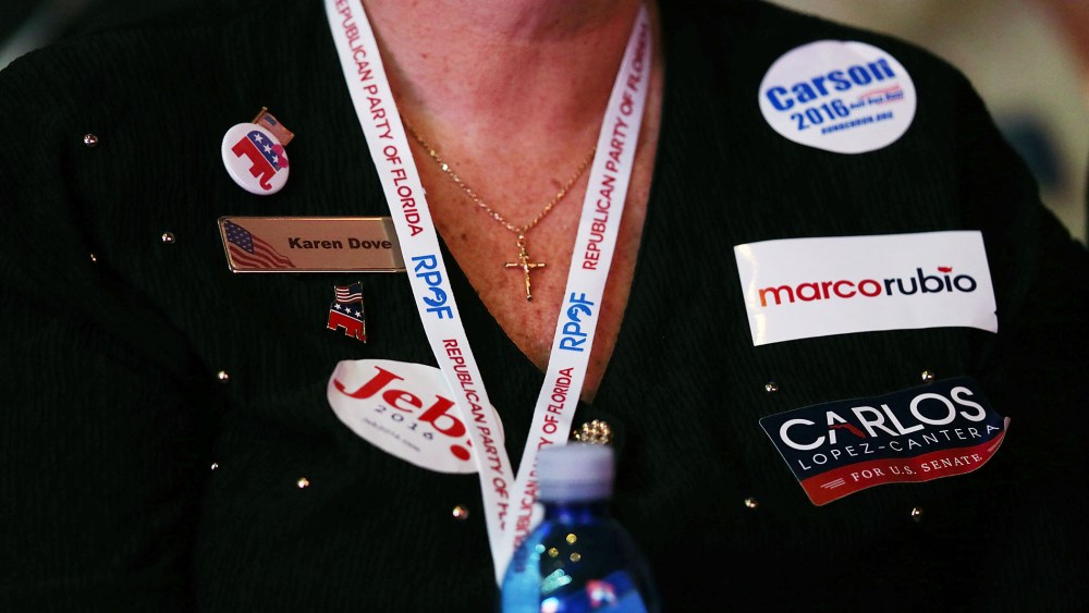 An attendee shows her support for Republican presidential candidates during the Sunshine Summit conference being held at the Rosen Shingle Creek on Nov. 13, 2015 in Orlando, Fla. (Photo by Joe Raedle/Getty)
