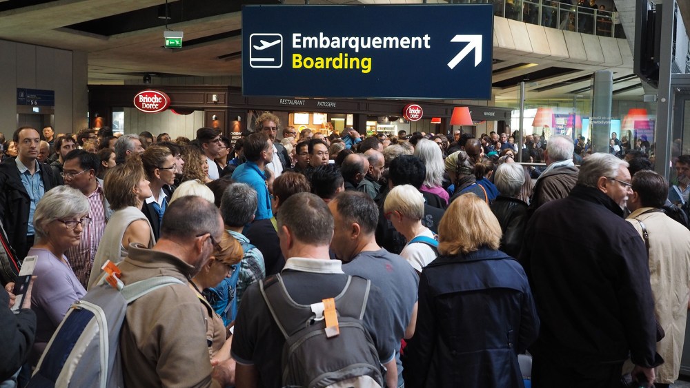 Tourists are seen as they wait in queues after they swarmed Charles De Gaulle airport in Paris, France, Nov. 14, 2015 following the attacks that left at least 128 people dead and 180 injured. (Photo by Mustafa Yalcin/Anadolu Agency/Getty)