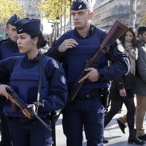 French police patrol at the Monument a la Republique, in the Place de la Republique in Paris, where people are gathering on Nov. 15, 2015, two days after a series of deadly attacks. (Photo by Patrick Kovarik/AFP/Getty)
