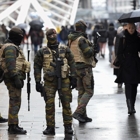 Soldiers patrol the Rue Neuve pedestrian shopping street in Brussels on Nov. 21, 2015. (Photo by John Thys/AFP/Getty)