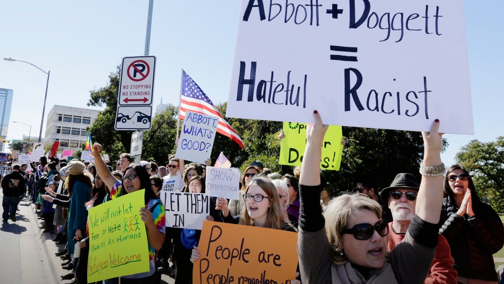 Members of The Syrian People Solidarity Group protest on Nov. 22, 2015 in Austin, Texas. (Photo by Erich Schlegel/Getty)